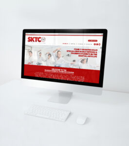 A martial art studio website displayed on a white computer monitor