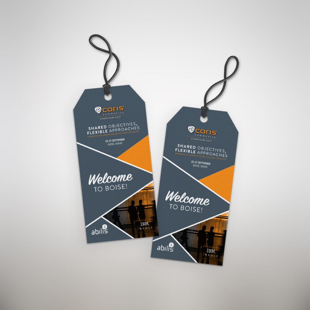 Coris 2023 Symposium gray and orange welcome tags.